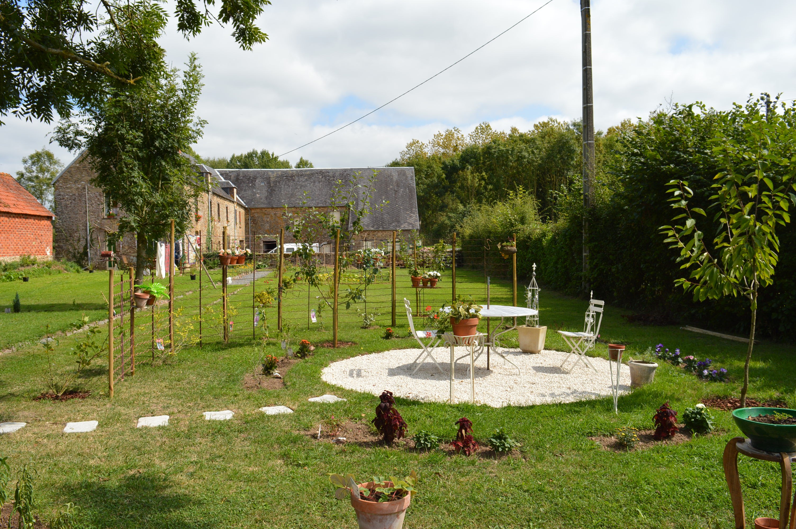 Garden and patio at Le Pont de la Pierre, Normandy